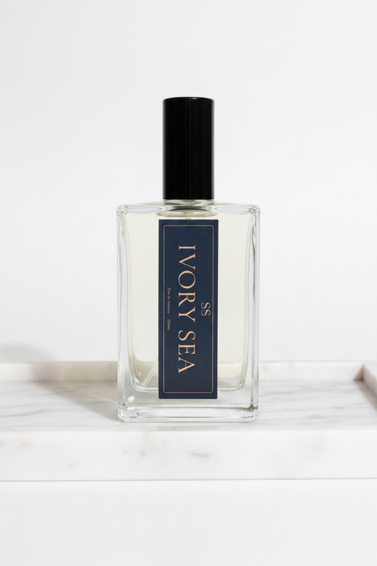 "Ivory Sea Eau de Parfum 100ml navy gift box with gold lettering and SS logo on white background — luxury perfume by SunShine Scents Candle Co."