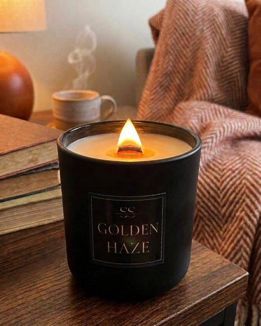 Matte Black: "Golden Haze 14.5 oz luxury coconut soy candle with wooden wick in matte black jar — warm vanilla and sandalwood fragrance"